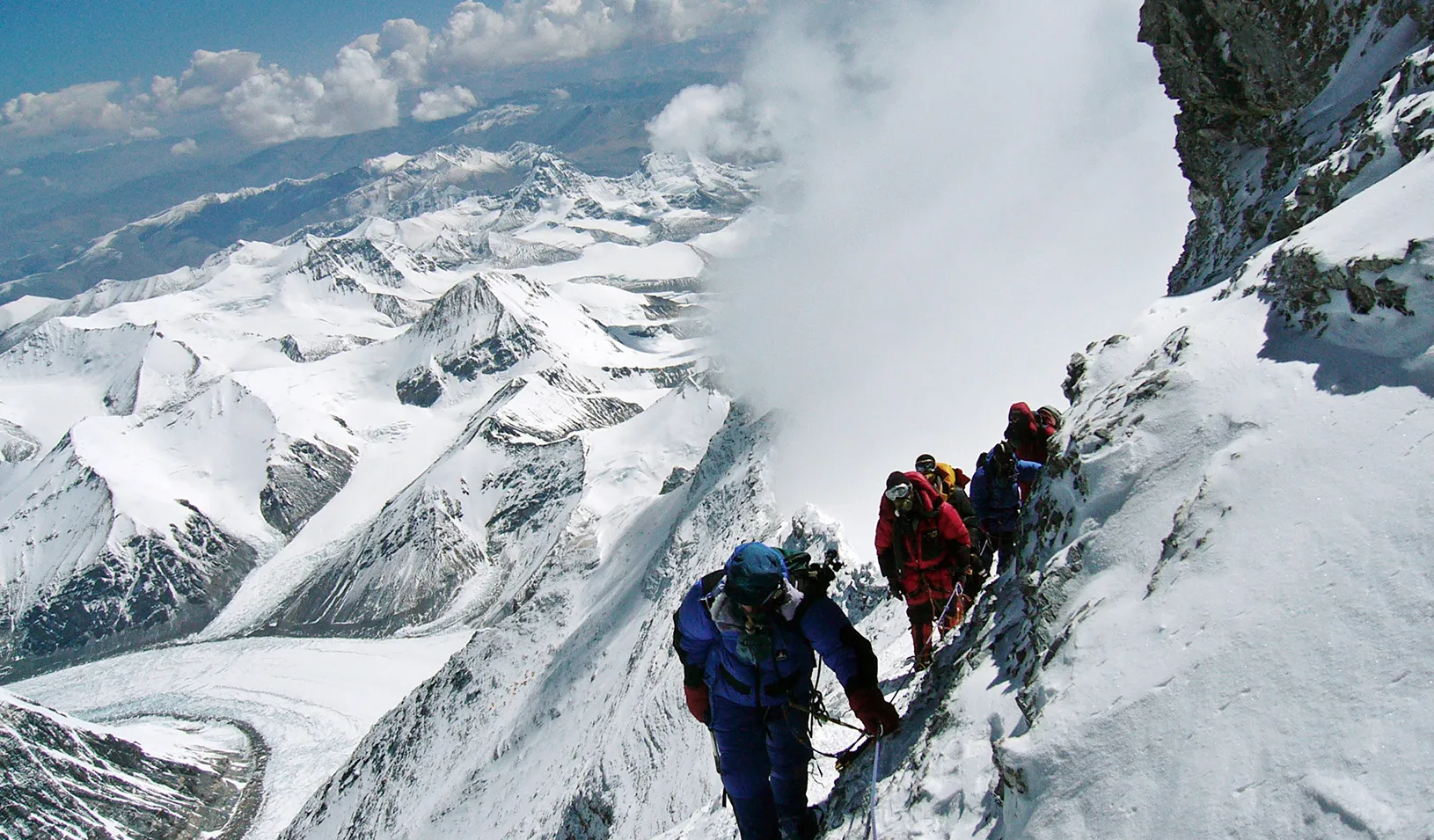Mountain climbers on a treacherous path