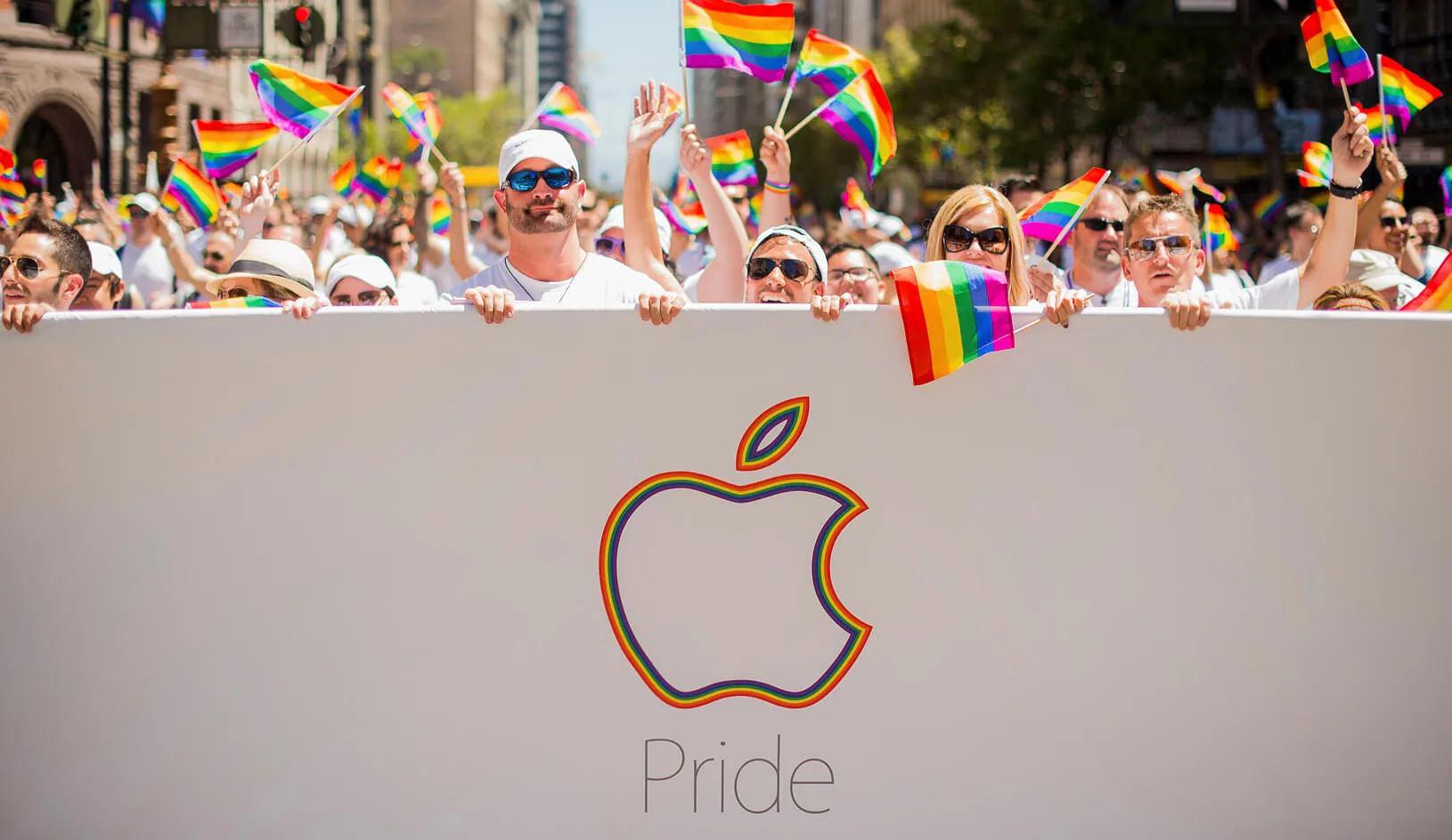 Apple employees carry rainbow flags as they march in the San Francisco Gay Pride Festival. Thousands of Apple employees donned specially designed T-shirts at the festival. Credit: Reuters/Noah Berger