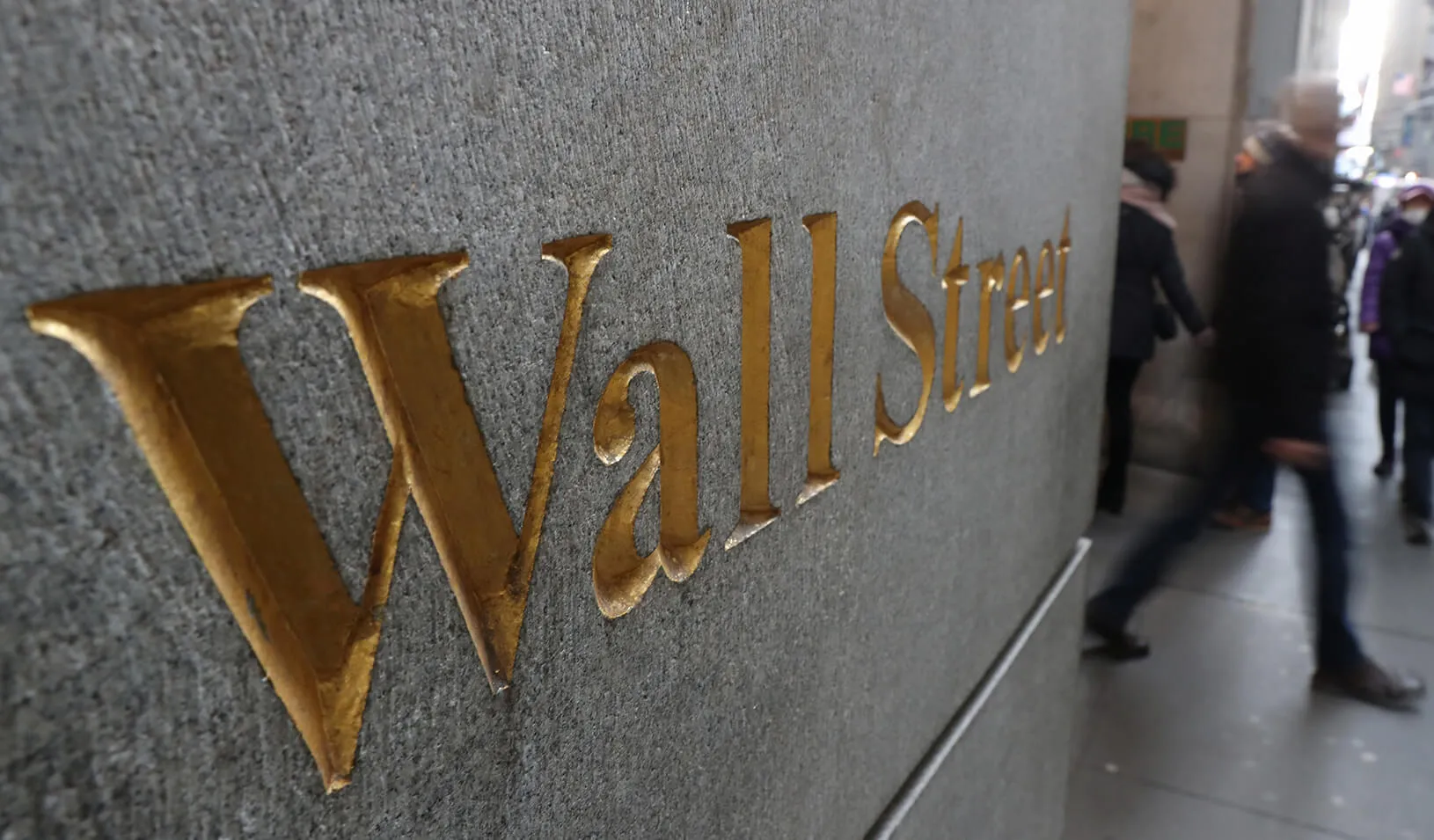 A street sign, Wall Street, is seen outside New York Stock Exchange in New York City. Credit: Reuters/Shannon Stapleton