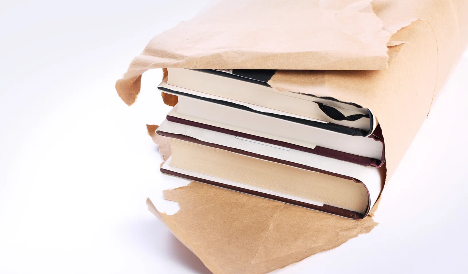A stack of books being unwrapped. Credit: iStock/Thinglass