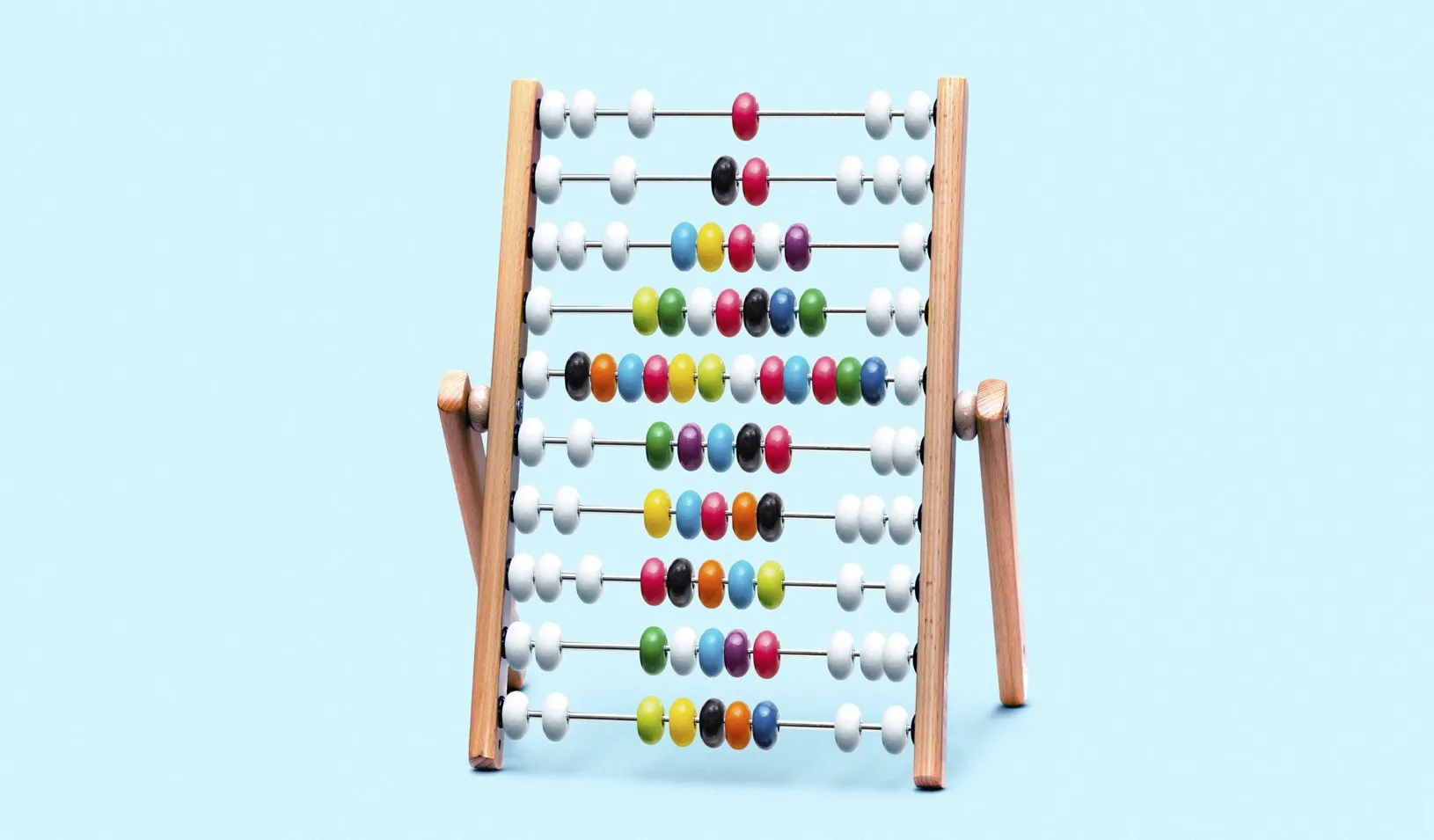 A photo illustration of an abacus with colored beads that show an upward arrow. Credit: Alvaro Dominguez