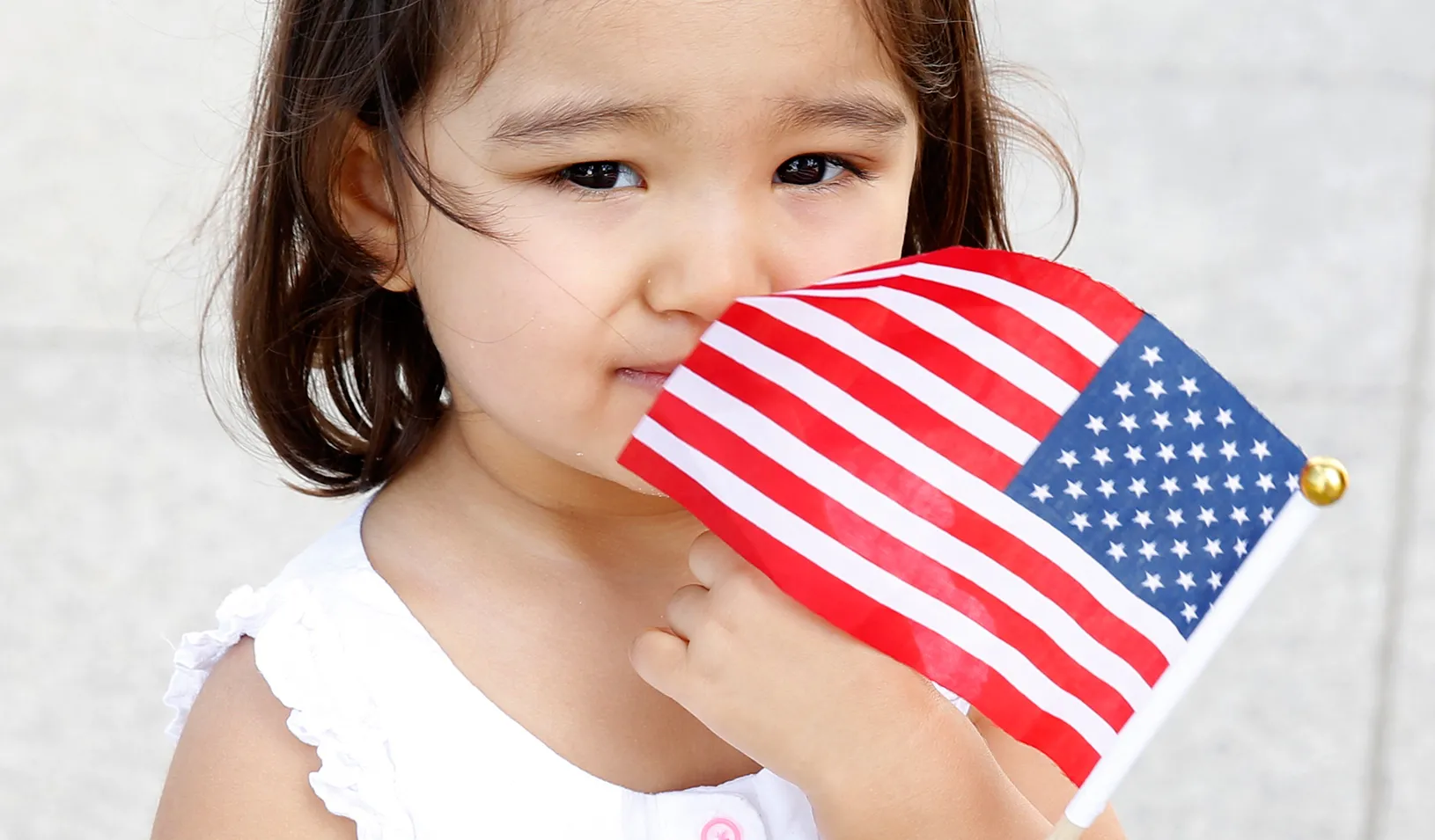 Little girl holding an American flag