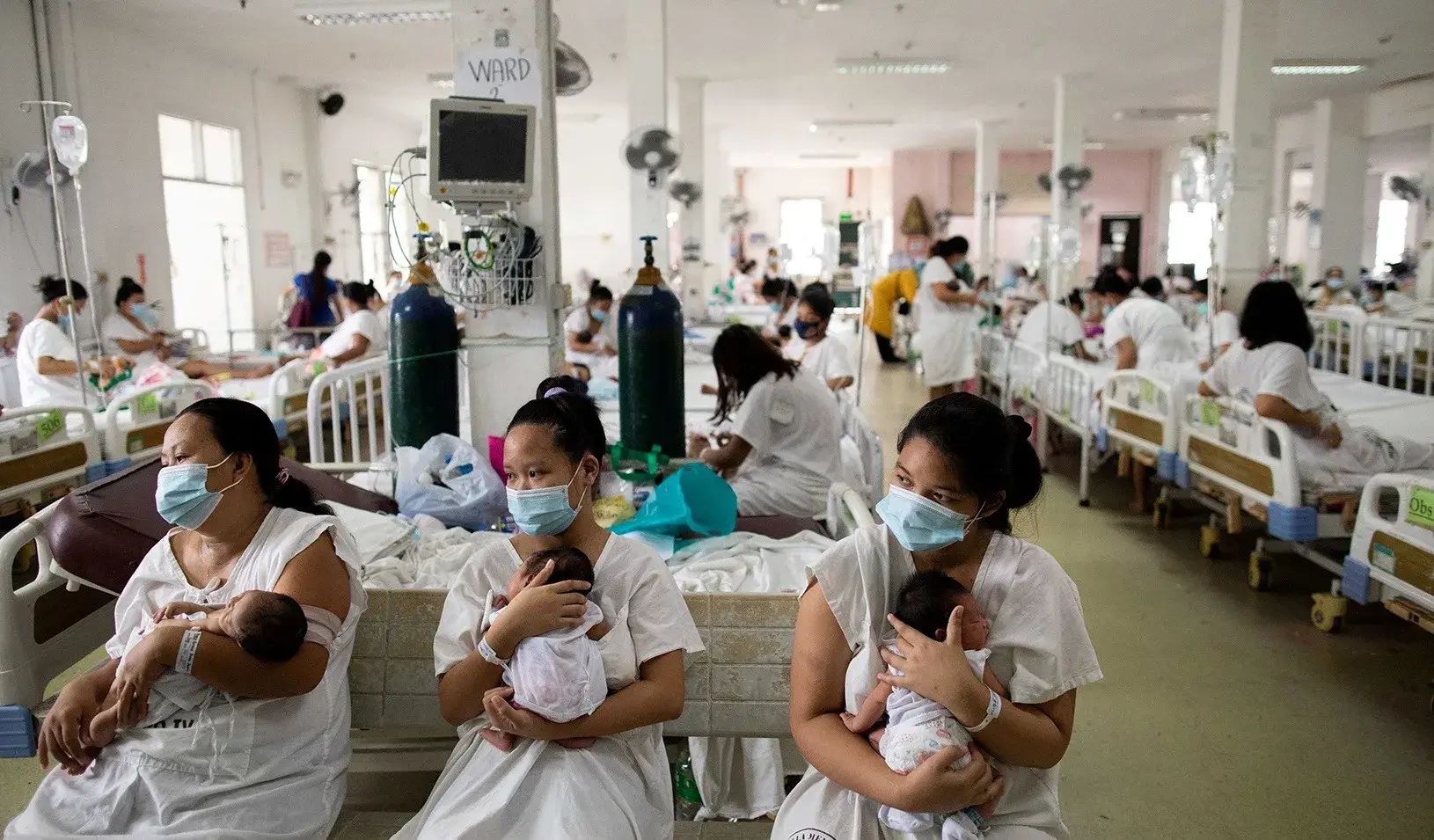 Mothers carrying their newborn babies queue for a check-up inside the maternity ward of the government-run Dr. Jose Fabella Memorial Hospital in Manila, Philippines. REUTERS/Eloisa Lopez
