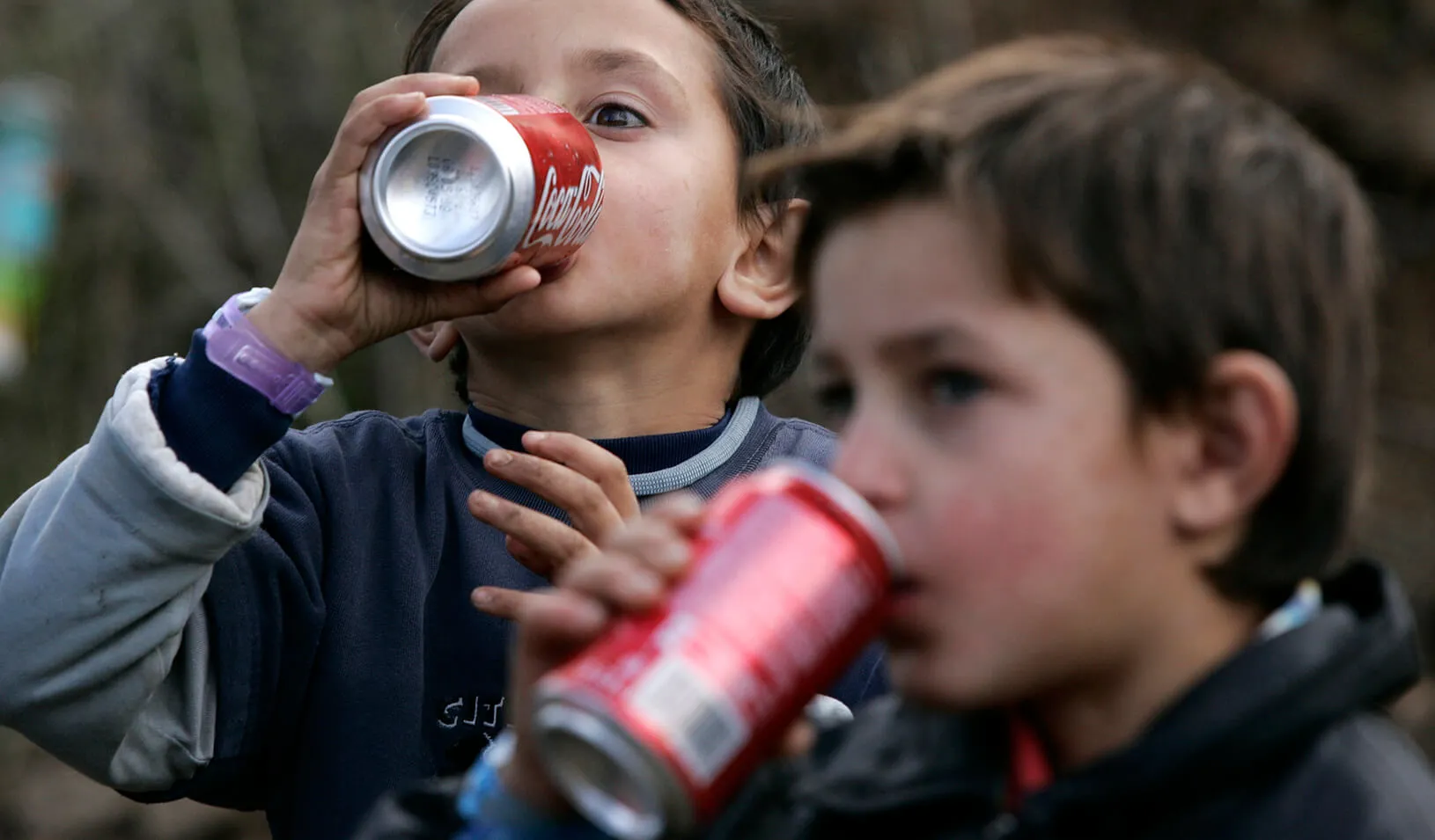 Children drinking Coca-Cola. Credit: Reuters/Hazir Reka