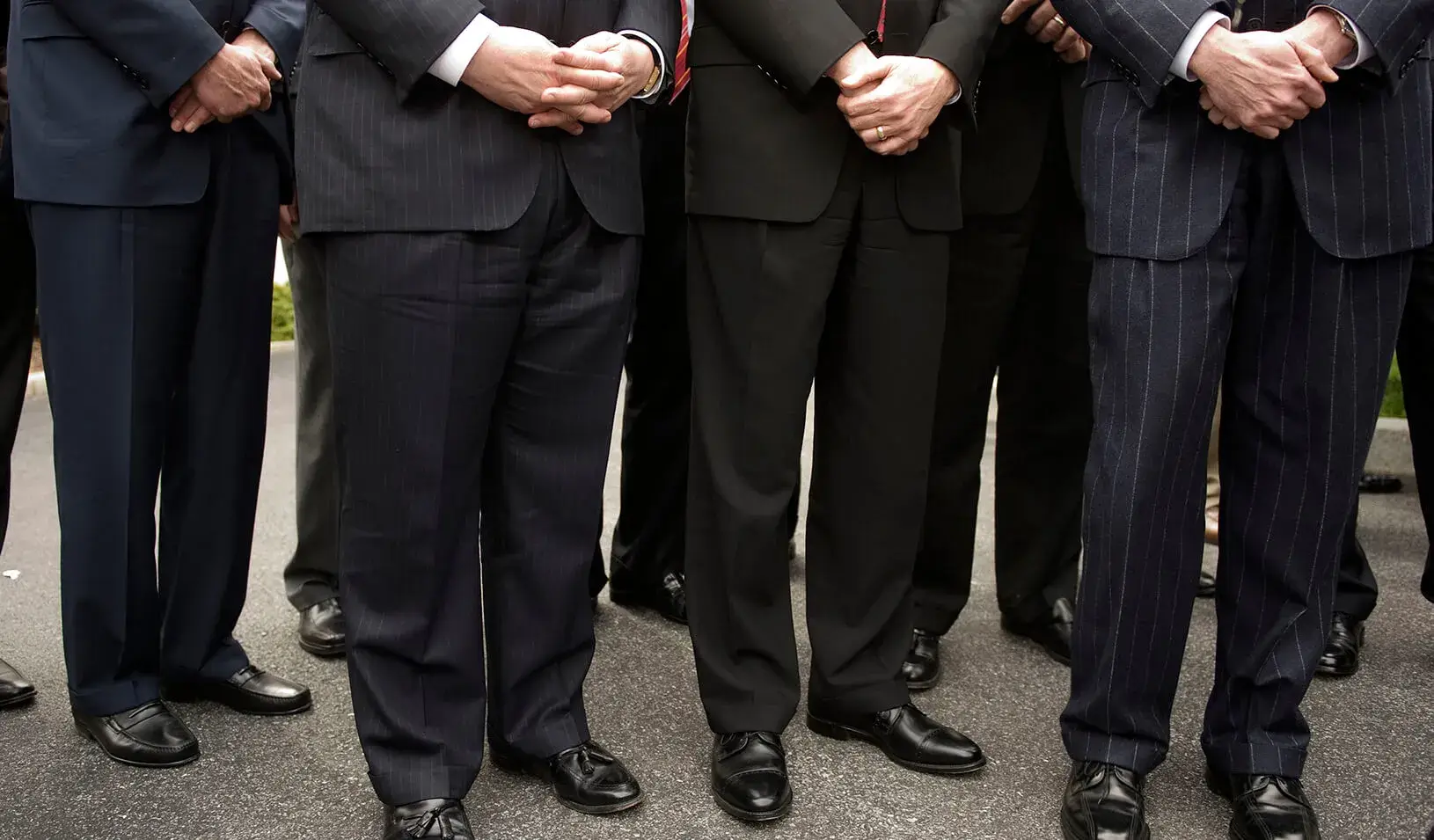 A group of men in pinstripe suits 