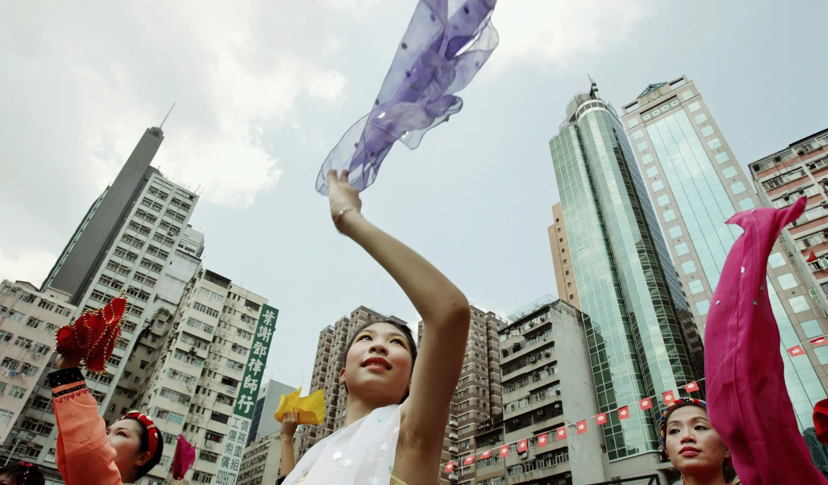 Women waving scarves in Hong Kong