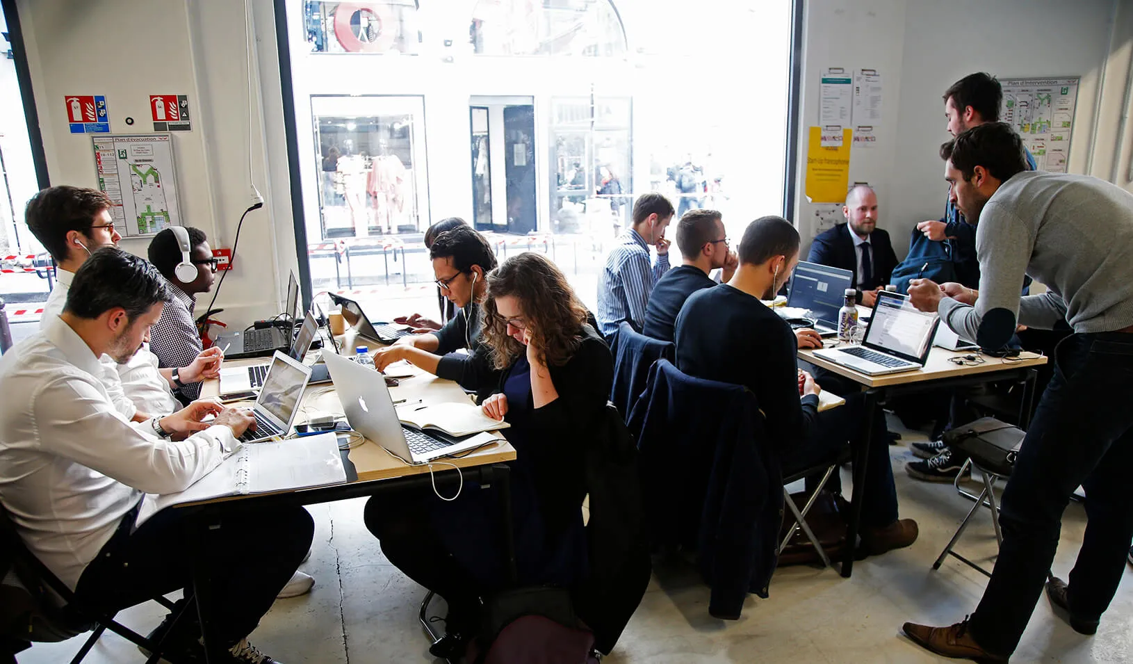 Entrepreneurs work at their computer laptops at the so-called "incubator" of French high-tech start-ups "Numa" in Paris, France.