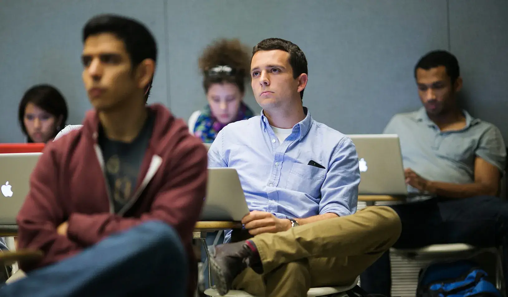 Man sitting listening to presentation
