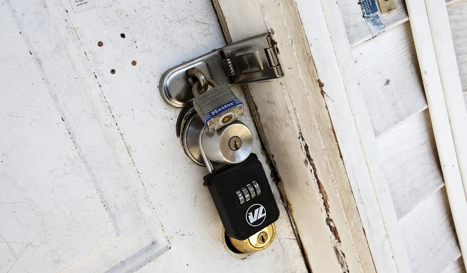 Locks are seen on the front door of an empty abandoned home. | Reuters/Mike Segar