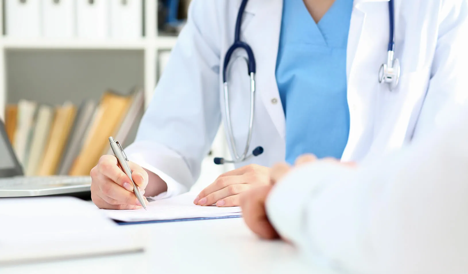 A doctor talks to her patient about treatment options.