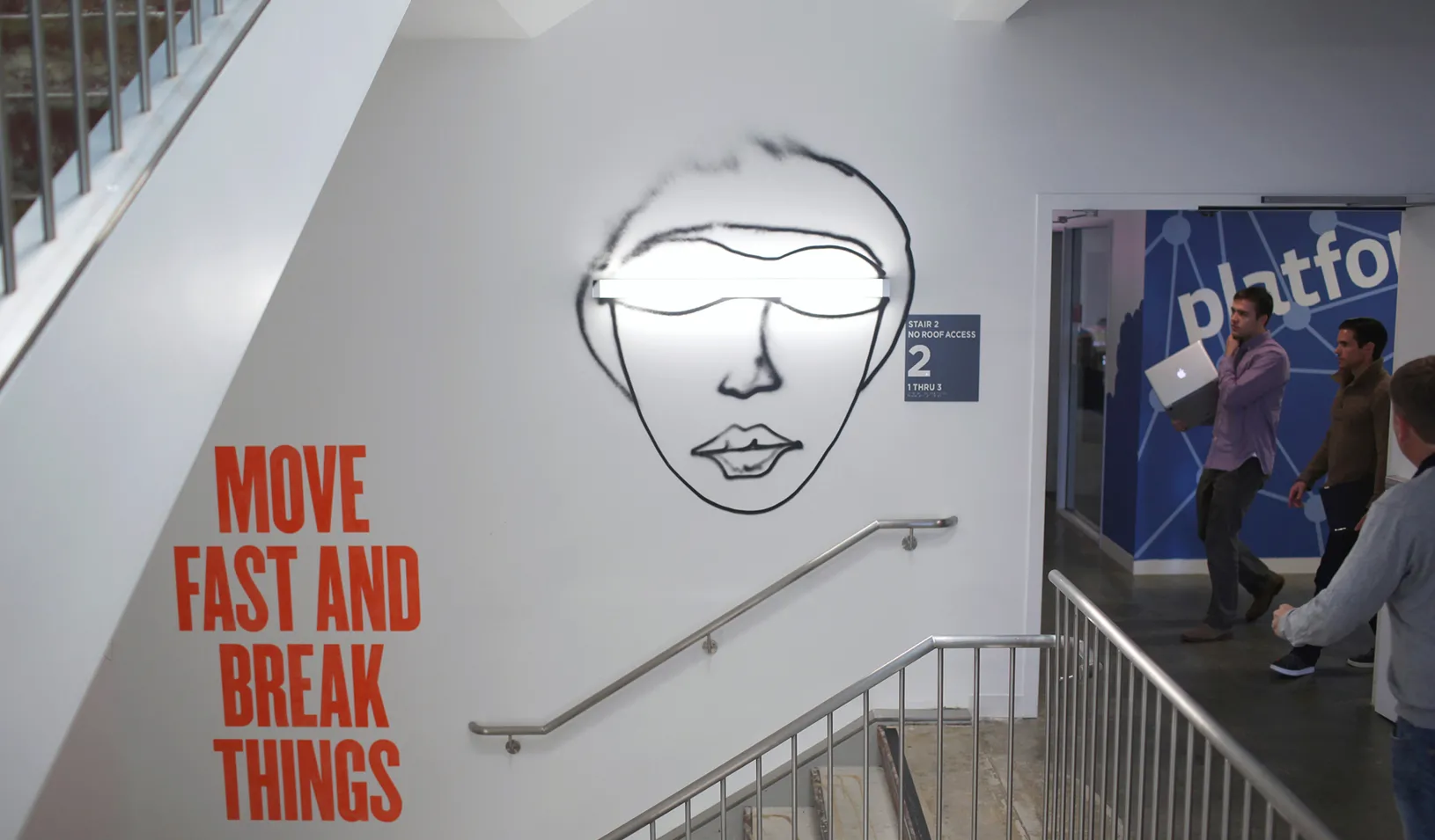 A message says "Move Fast and Break Things" in a Facebook HQ stairwell