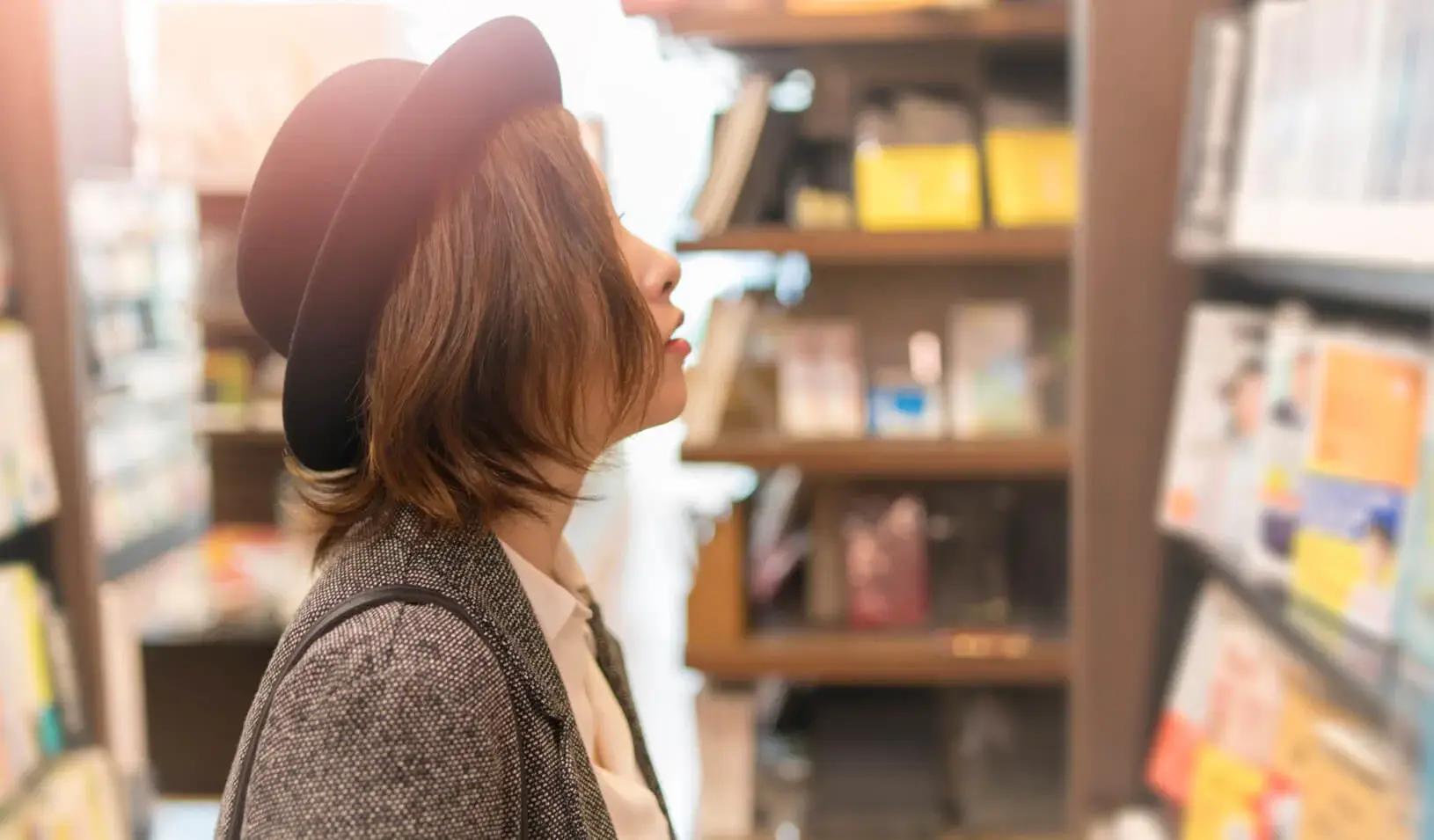 A woman browsing the shelves at a bookstore. Credit: iStock/Satoshi-K