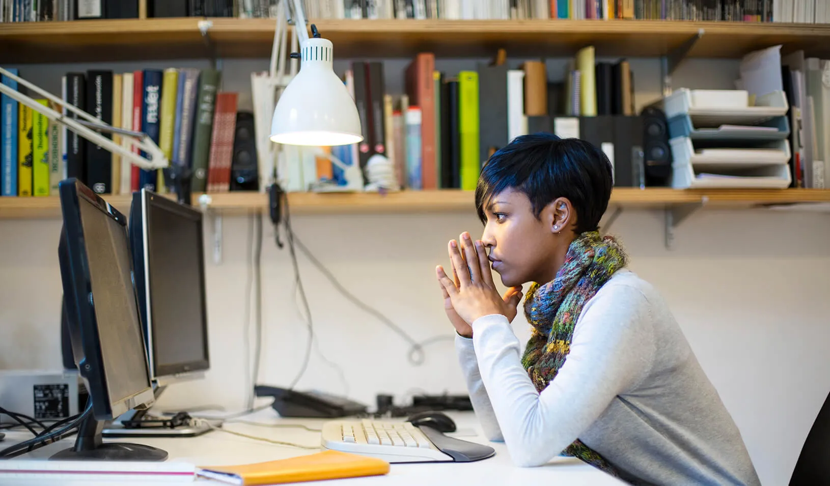 A chid watches a computer screen | iStock/alvarez
