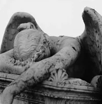 A sculpture of a sad angel