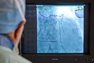 Doctor looking at a high-tech image of the human body