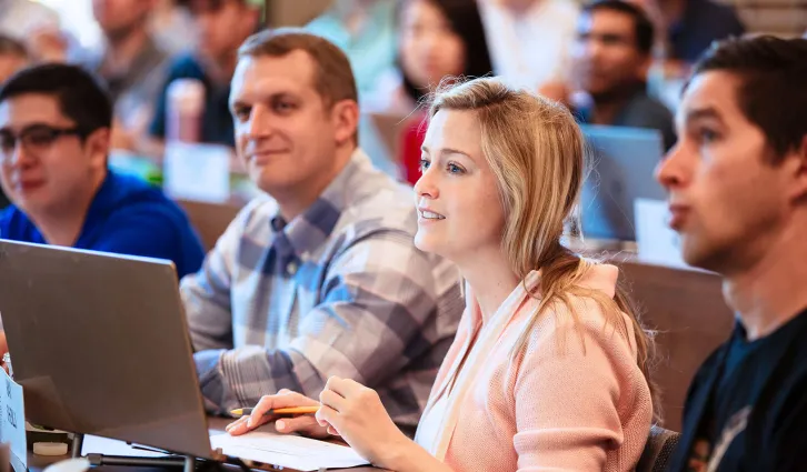 A student with her laptop in a classroom. Credit: Elena Zhukova