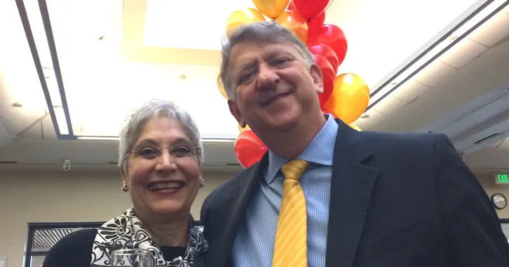 Barbara Firpo with Dean Garth Saloner at the January 21, 2016 celebration of her 50 years of service. 