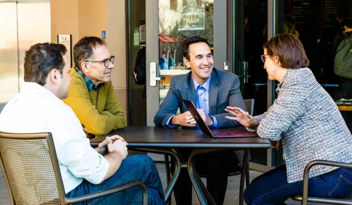 From left to right: Michael Ostrovsky, Guido Imbens, Dean Jonathan Levin, and Susan Athey | Toni Bird
