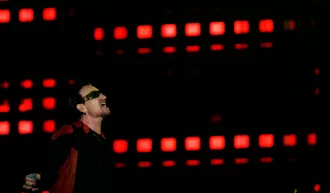 U2's lead singer Bono performs during their 'Vertigo' tour concert in Buenos Aires. Credit: REUTERS/Marcos Brindicci