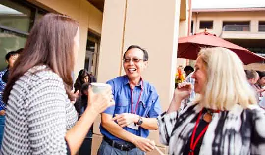 Executive Education participants gathering outside after a session
