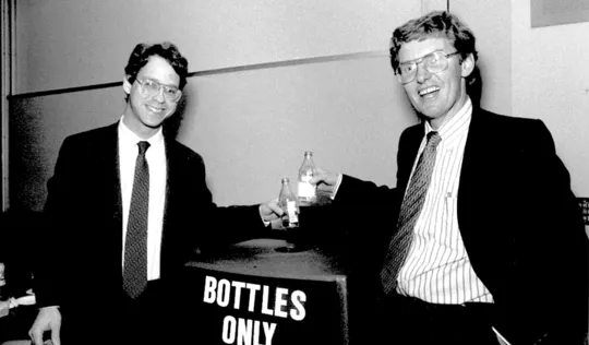 Two men smiling; I assume one is Conradin Von Gugleberg