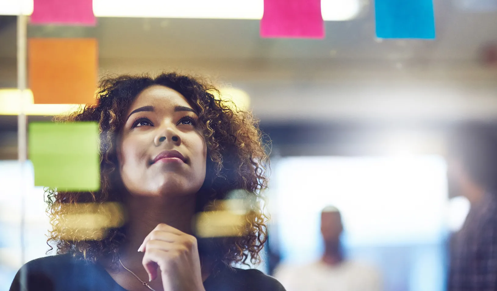 A woman uses design thinking to plan. Credit: iStock/Peopleimages