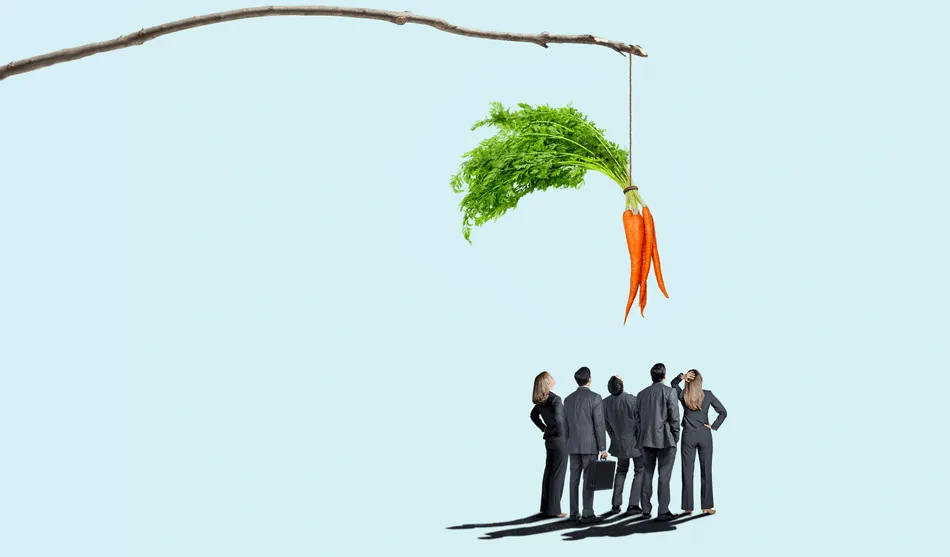 A group of businesspeople stand together looking up at a dangling carrot. Credit: iStock/DNY59, Tricia Seibold