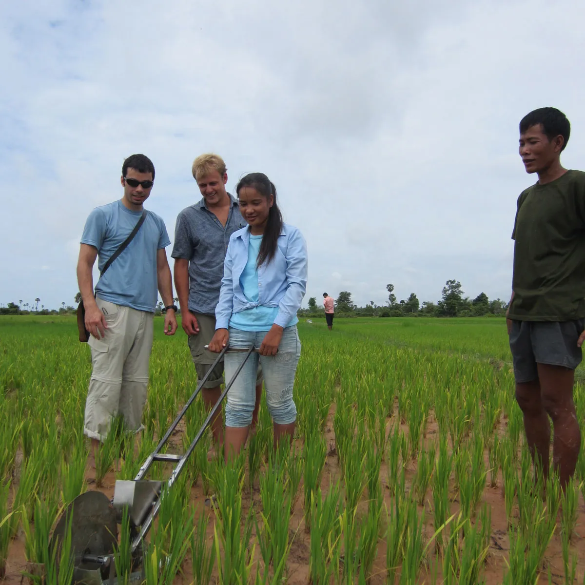 A team of Entrepreneurial Design for Extreme Affordabiilty field tests the RiceRunner, a fertilizer applicator, in Cambodia