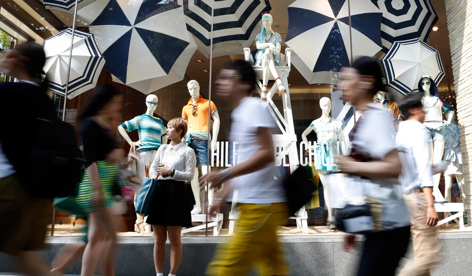 In front of a luxury brand store in Tokyo (Reuters photo by Yuya Shino)