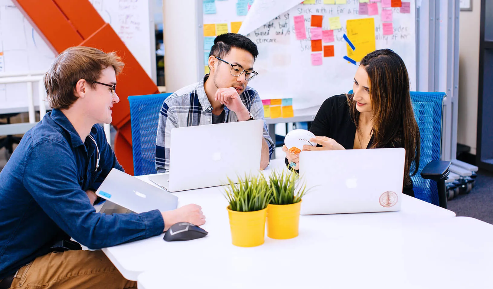 Students sit and work on a project together. Credit: Elena Zhukova
