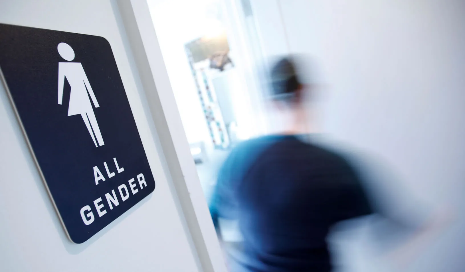 A bathroom sign welcomes both genders at the Cacao Cinnamon coffee shop in Durham, North Carolina, United States on May 3, 2016. | Reuters/Jonathan Drake