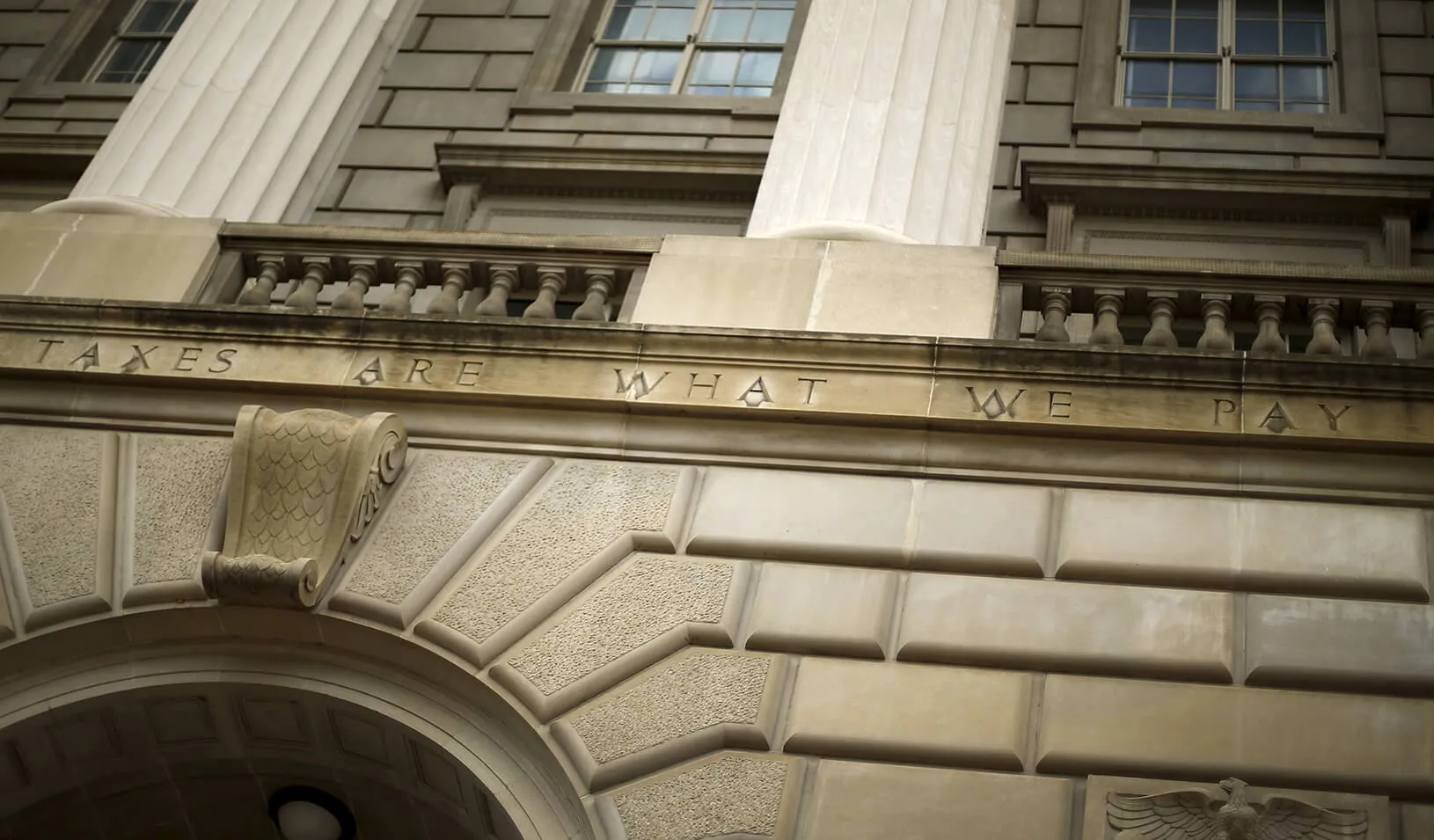 A general view of the U.S. Internal Revenue Service (IRS) building, with the partial quote "taxes are what we pay," in Washington, D.C. | Reuters/Jonathan Ernst