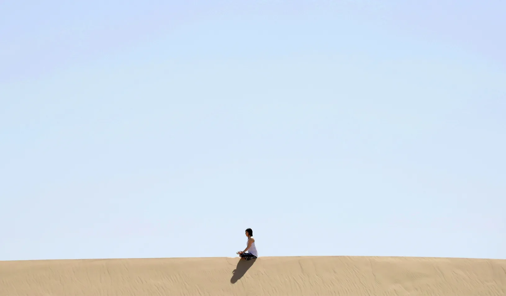 A yoga enthusiast rests after a class at the Samalayuca dunes, on the outskirts of Ciudad Juarez, Mexico. Credit: Reuters/Jose Luis Gonzalez