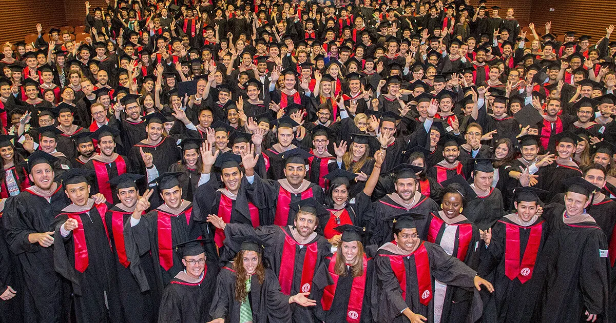 The Stanford MBA Class of 2017 gathers in CEMEX Auditorium before the commencement processional. | Saul Bromberger