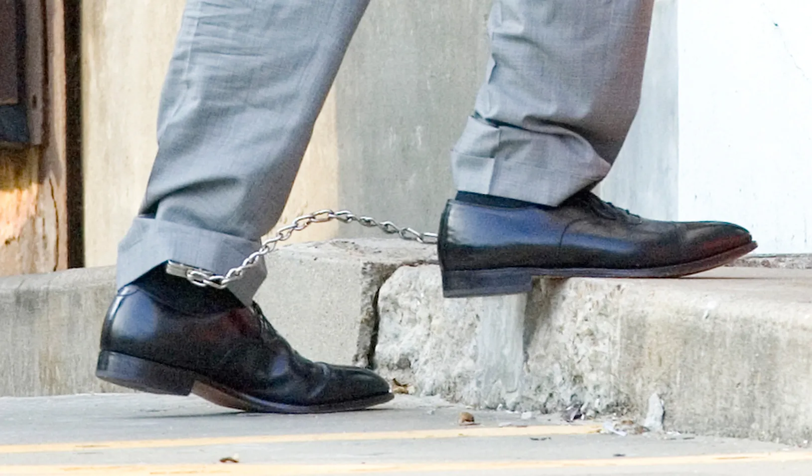 Two feet chained together. | Reuters/Steve Campbell