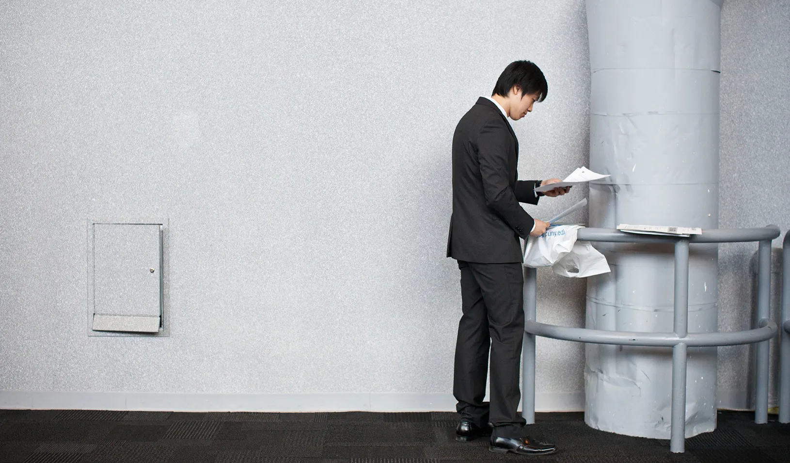 A man organizes his papers before meeting