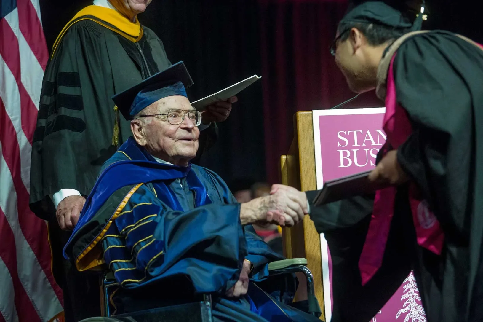 Arjay Miller enjoyed participating in graduation ceremonies and was on hand in June 2017 to shake the hand of graduates designated Arjay Miller Scholars, who represented the top 10 percent of the class based on academics. | Saul Bromberger