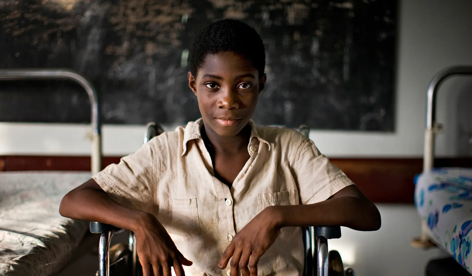  child sitting in a wheelchair at the Center for the Rehabilitation of the Handicapped in Yaounde, Cameroon 