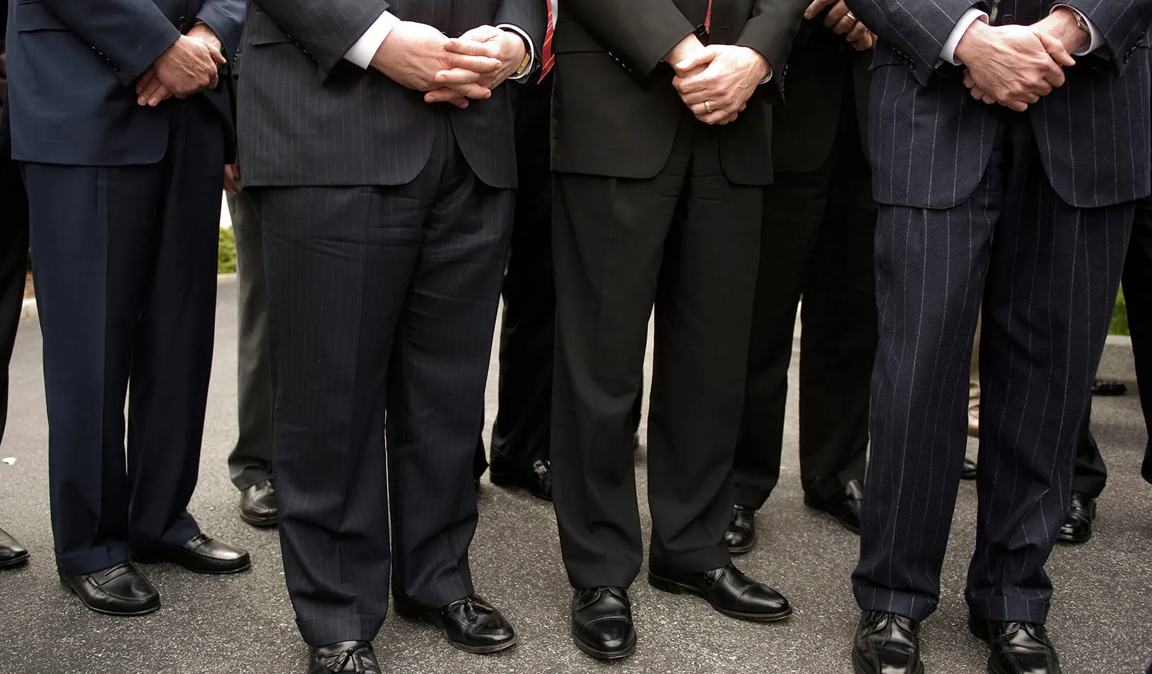 A group of men in pinstripe suits | Reuters/Larry Downing 