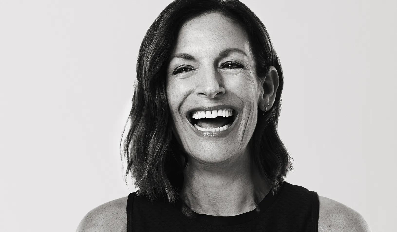 Black and white portrait of Ruth Zukerman laughing and looking off camera. Credit: Courtesy of Ruth Zukerman