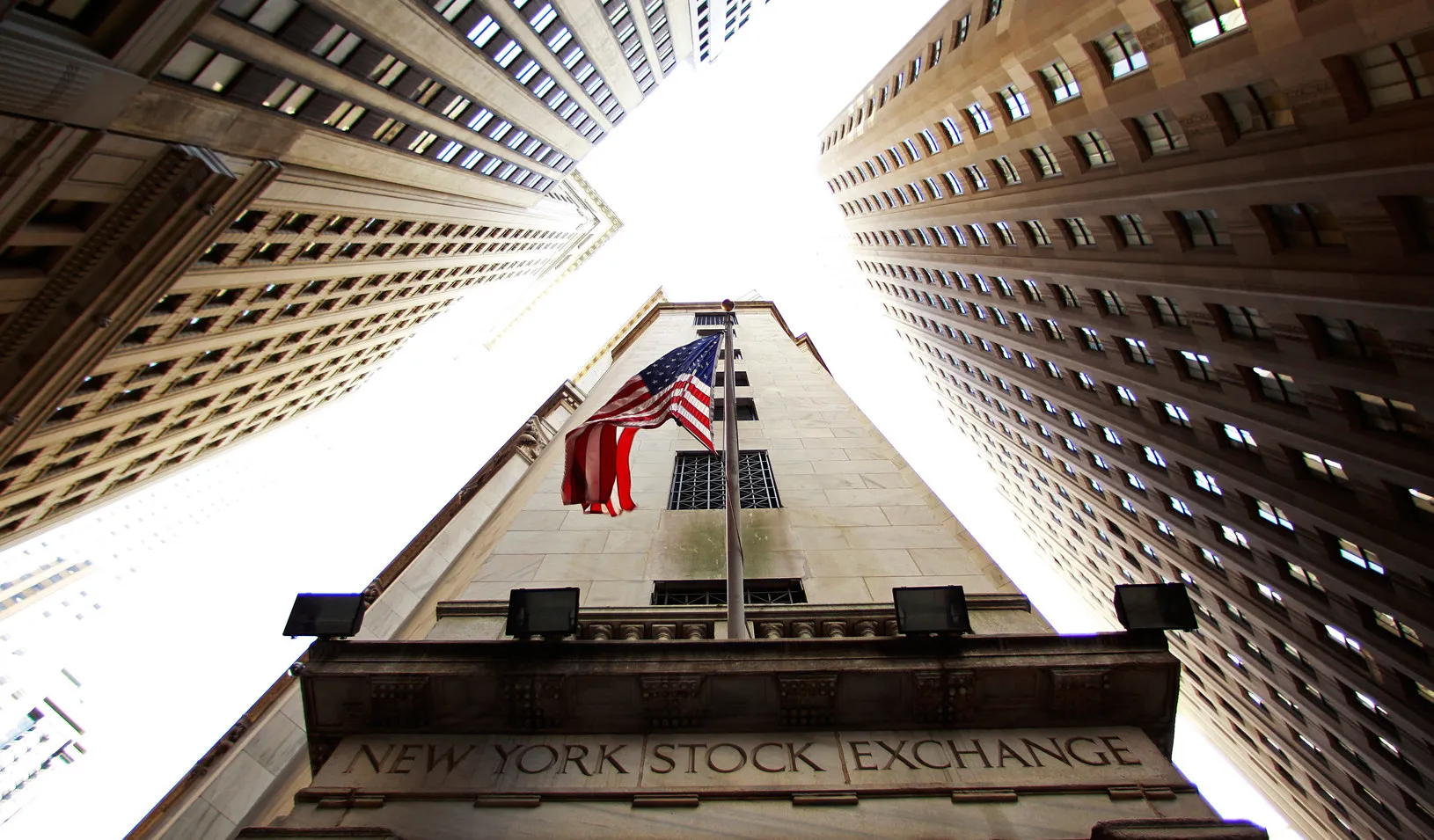 A flag flies on outside of the New York Stock Exchange building in New York.