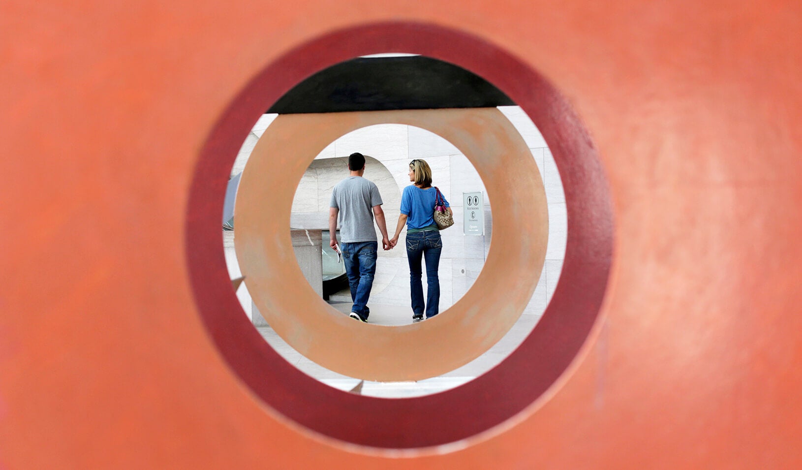 A couple holding hands, intent on each other | Reuters/Kevin Lamarque